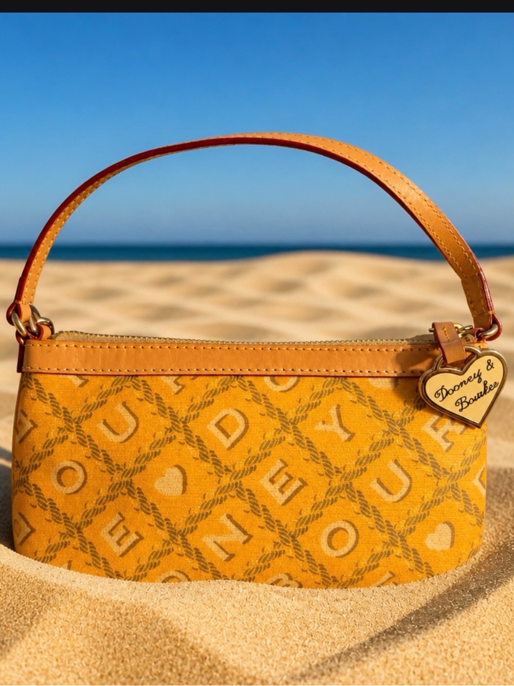 Dooney & Bourke Yellow Logo
Jacquard Wristlet EUC